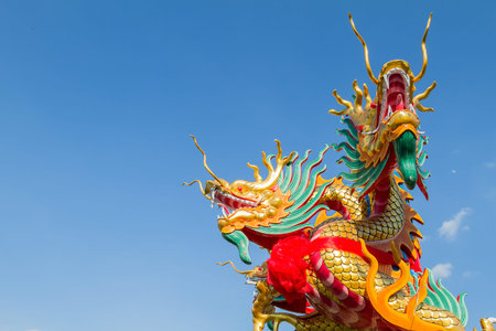 Dragon head on blue sky background