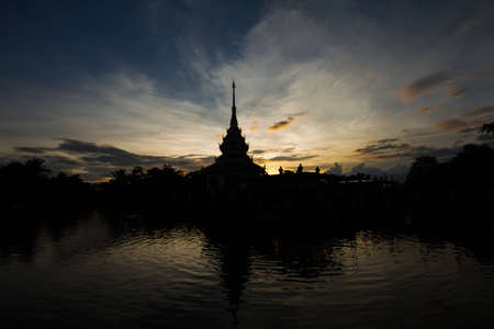 Silhouette of Thai temple during sunset with the elegance moodの写真素材