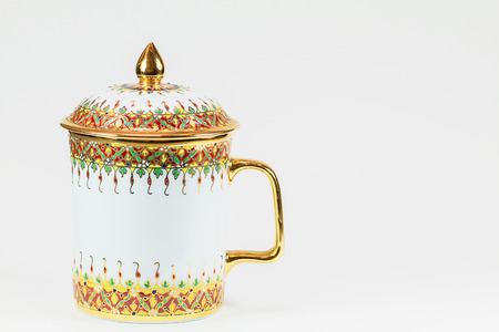 Thai antique porcelain drinking glass on white backgroundの写真素材