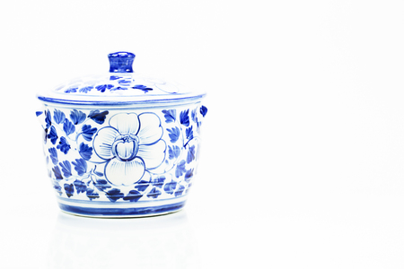 Blue porcelain with reflection on white backgroundの写真素材