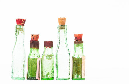 Antique grunge  medicine bottles on white backgroundの写真素材