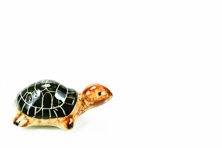 Ceramic black turtle on white backgroundの写真素材