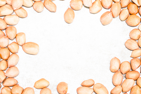 Peanuts formed as border on grunge metal sheetの写真素材