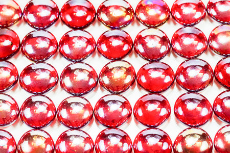 Texture background of red glass marbles on white background