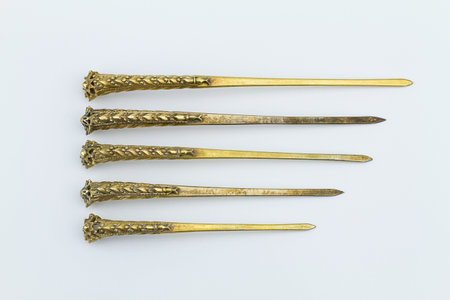 Old Thai rusty grunge ancient brass  hairpin on white backgroundの写真素材