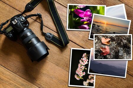 DSLR digital camera and vintage grunge wooden background, photography hobby holiday conceptの写真素材