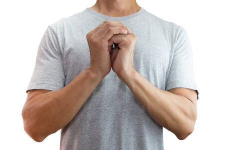Asian man holding hands together praying isolated on white background with clipping path