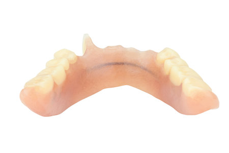 Old dentures isolated on white background