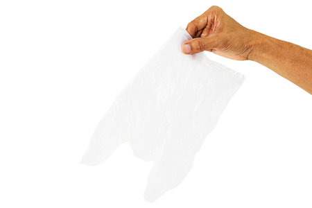 Hand holding empty white transparent plastic bag  on white backgorundの写真素材
