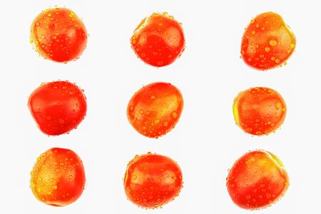 Fresh red tomatoes with water drops isolated on white backgroundの写真素材