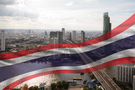 Transparent of national Thai flag fluttering above Bangkok city background, top view