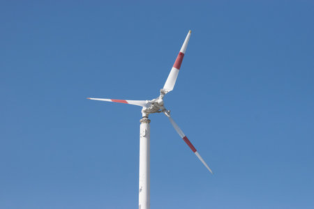 wind turbine  against blue sky background