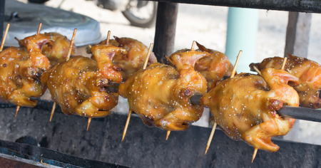 Chicken being cooked and grilledの写真素材