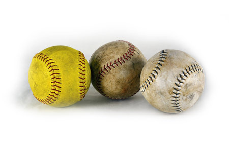 Three baseballs in a row, after a good baseball game