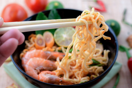 Tom yum kung with noodles, popular Thai dish cuisine