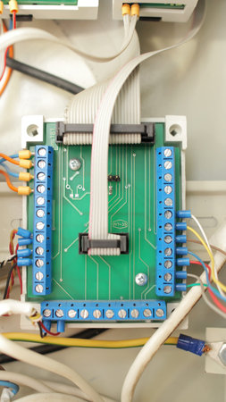 Detail of an electronic printed circuit board with many electrical components