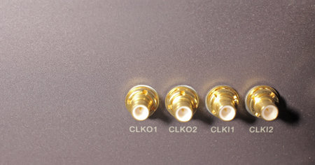 Four gold connectors in a room mobile networks
