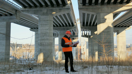 The engineer checks the documents