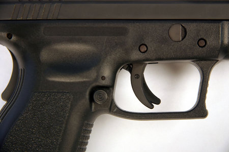 Trigger mechanism of a 9mm handgun.