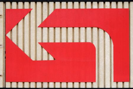 Parking lot directional arrow indicating left turnの写真素材