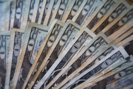 United States currency - stack of twenty dollars bills fanned out 