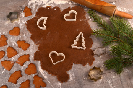 Flat rolled Raw gingerbread dough for cooking Christmas cookies, top view, Gingerbread dough background. Prepare Christmas gingerbread cookiesの写真素材