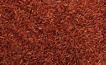 raw red rice background. uncooked brown wild rice, top view