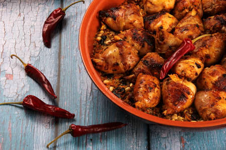 Traditional moroccan tajine of chicken with dried fruits and spices, top view. Moroccan chicken tajine with couscousの写真素材