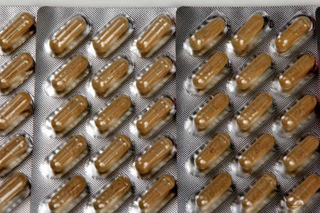 Riga, Latvia - may 03, 2021: Immunup Box and capsules for REINFORCEMENT FOR THE IMMUNE SYSTEM on white background. An effective supplement for supporting the immune systemのeditorial素材