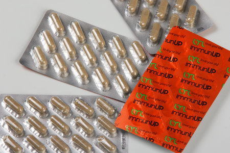 Riga, Latvia - may 03, 2021: Immunup Box and capsules for REINFORCEMENT FOR THE IMMUNE SYSTEM on...