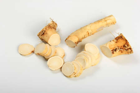 Cut Horseradish roots isolated on white background. Fresh horseradish.の写真素材