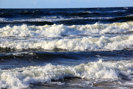 Seascape during a storm with big waves, close-up, Carnikava, Latvia. Big and powerful sea waves...