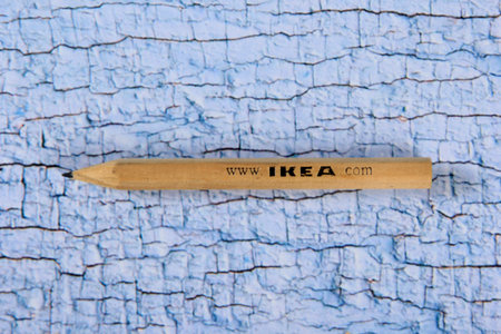 Riga, Latvia- october 25, 2021: Classic wooden IKEA pencil on wooden board background