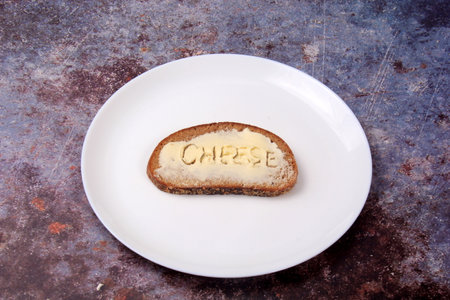 Sandwiches with the inscription meat, sausage, cheese in butter. Symbolizes the food crisis in the worldの写真素材