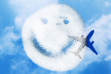 Smiley of soap suds on blue backgroundの写真素材