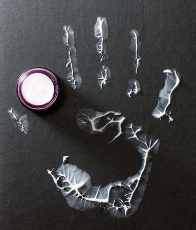 Human hand imprint on black backgroundの写真素材