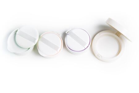 Refills of foundation and highlighter cushion on a white backgroundの写真素材