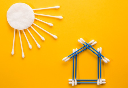 The symbol of a house made of blue sticksの写真素材