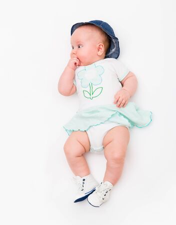 Portrait of a baby girl on a white backgroundの写真素材