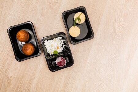 Healthy food delivery. Take away food for diet. Fitness nutrition, balanced proteins, fats and carbohydrates in plastic boxes. Top view, flat lay.の写真素材