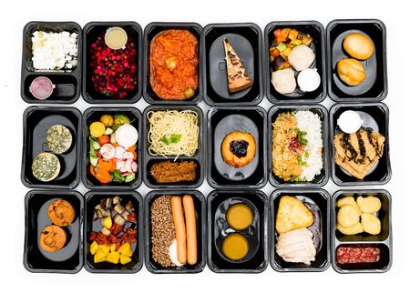 food in containers on a dark background. food delivery. healthy food. over viewの写真素材