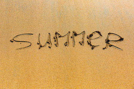 inscription on the wet sand near the sea or lake.の写真素材