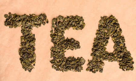 inscription tea made from dried tea leaves on a background of beige kraft paperの写真素材