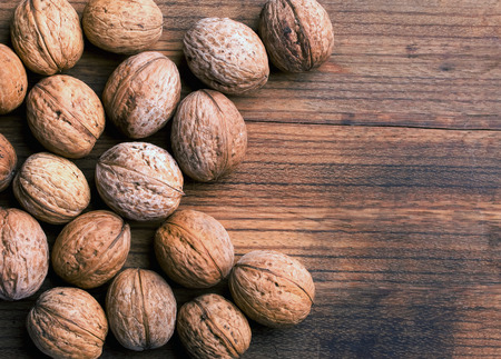 Walnut and wooden backgroundの写真素材