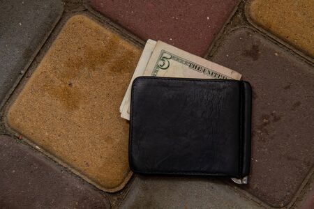 wallet on the sidewalkの写真素材