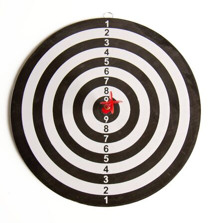 Close-up dart board with a red arrow that hit the center of the targetの写真素材