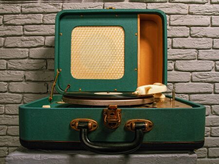 old green electric gramophone with music recordの写真素材