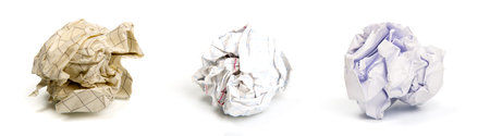 several sheets of crumpled discarded paper isolated on a white background