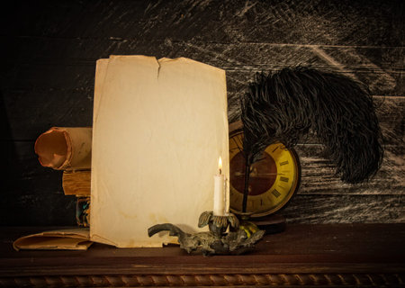 old books parchments and scrolls pen with inkwell with empty place for text on a dark background by...