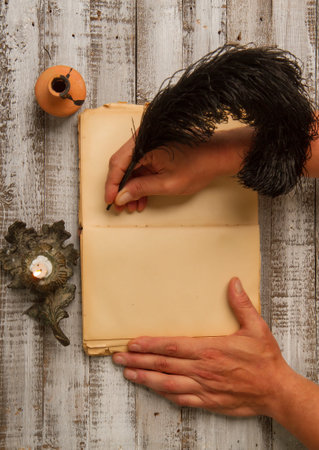 blank old diary author's hand and writing supplies ink feather penの写真素材